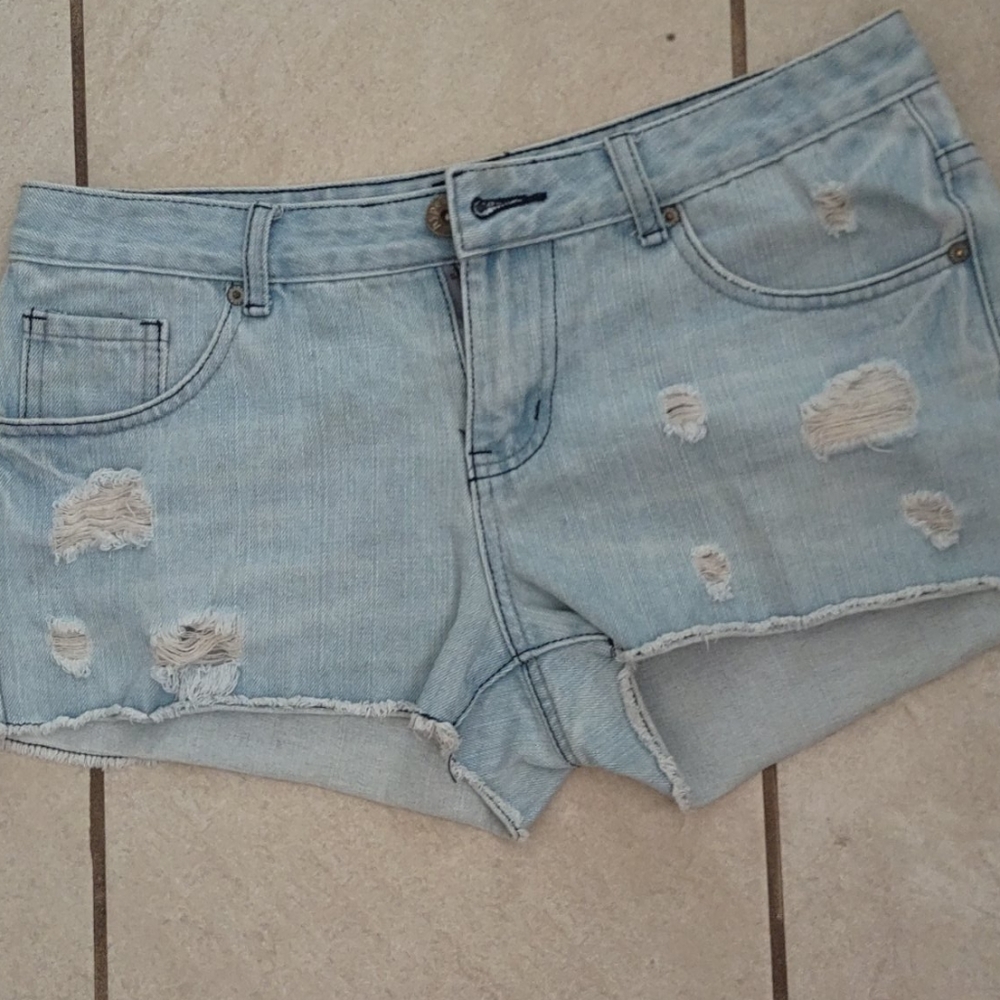 a pair of distressed jean shorts